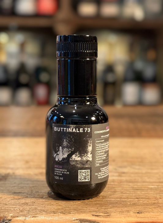 BUTTINALE 73 - Aglio-  condimento a base di olio di oliva